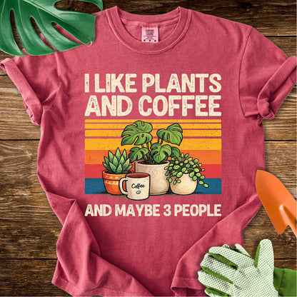 Crimson red Comfort Colors T-shirt with plants, coffee, and retro stripes with "I Like Plants and Coffee and Maybe 3 People".