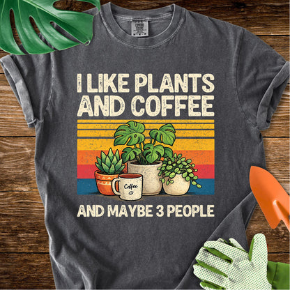 Pepper charcoal gray Comfort Colors T-shirt with plants, coffee, and retro stripes with "I Like Plants and Coffee and Maybe 3 People".