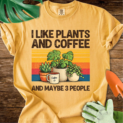 Mustard yellow Comfort Colors T-shirt with plants, coffee, and retro stripes with "I Like Plants and Coffee and Maybe 3 People".