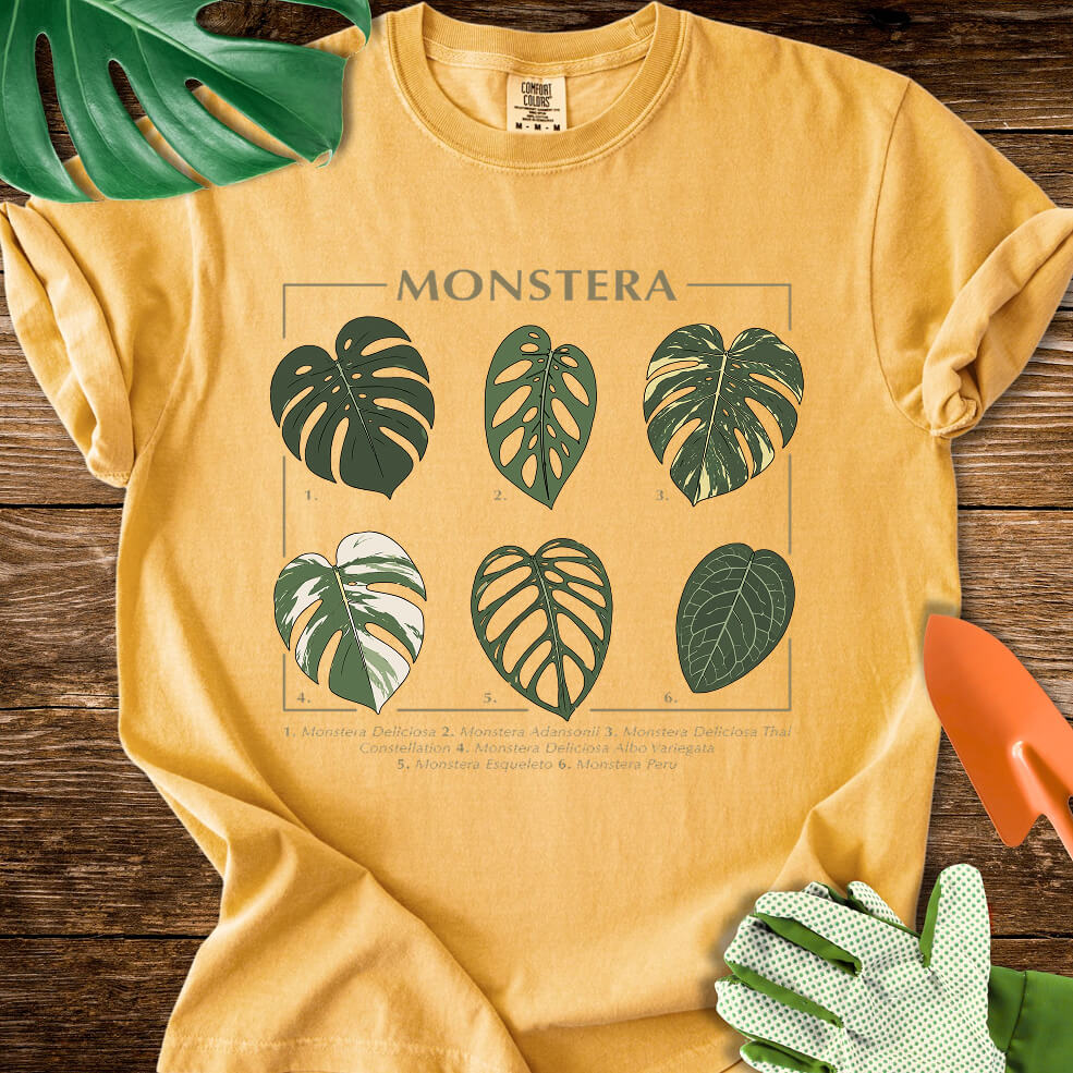 Mustard yellow Comfort Colors T-shirt with a labeled botanical chart of different Monstera leaves.