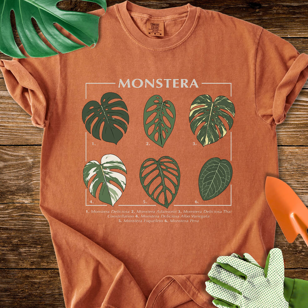 Burnt orange Comfort Colors T-shirt with a labeled botanical chart of different Monstera leaves.