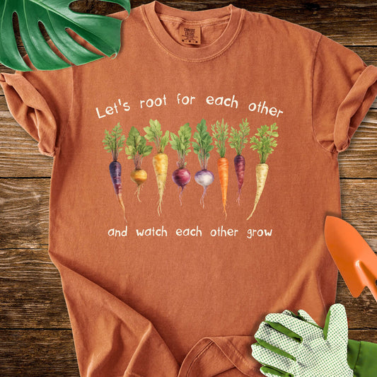 Burnt orange Comfort Colors T-shirt with root vegetables and "Let's Root for Each Other and Watch Each Other Grow".