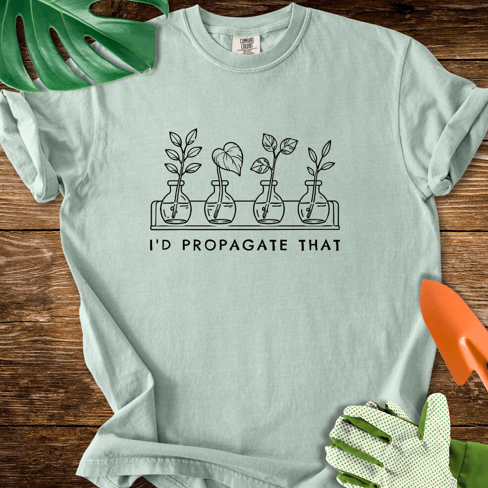 Bay sage green Comfort Colors T-shirt with cuttings in propagation bottles beneath "I'd Propagate That".