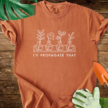 Burnt orange Comfort Colors T-shirt with cuttings in propagation bottles beneath "I'd Propagate That".