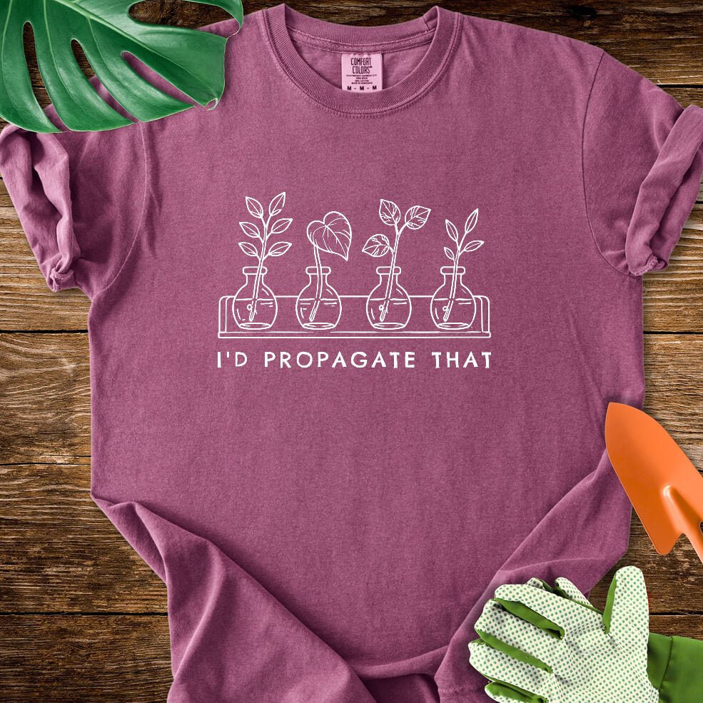 Berry purple Comfort Colors T-shirt with cuttings in propagation bottles beneath "I'd Propagate That".