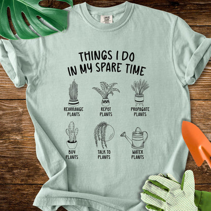 Bay sage green Comfort Colors T-shirt with six illustrated plant hobbies under "Things I Do in My Spare Time".