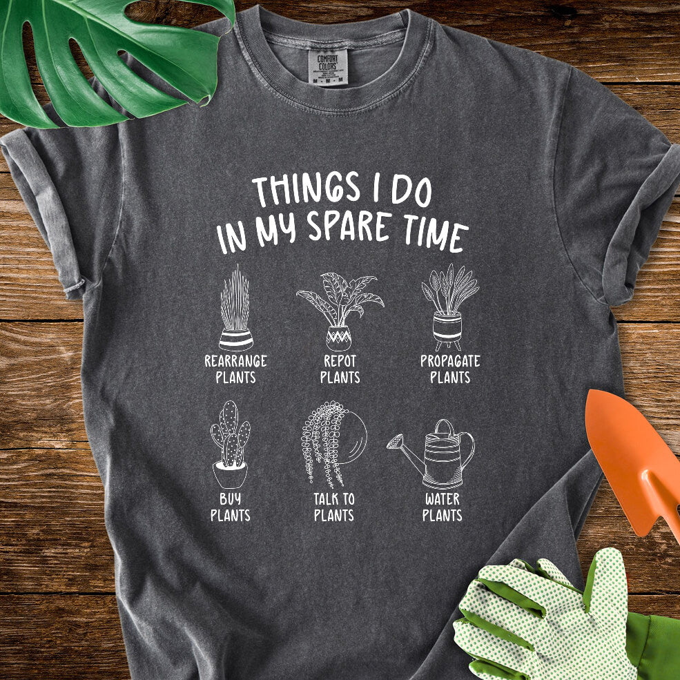 Pepper charcoal gray Comfort Colors T-shirt with six illustrated plant hobbies under "Things I Do in My Spare Time".