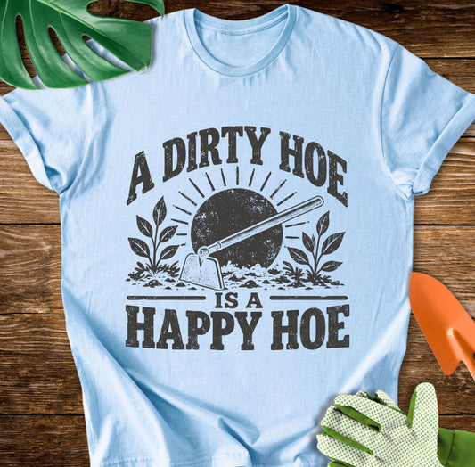 Light blue T-shirt with a garden hoe, plants, and "A Dirty Hoe Is a Happy Hoe".