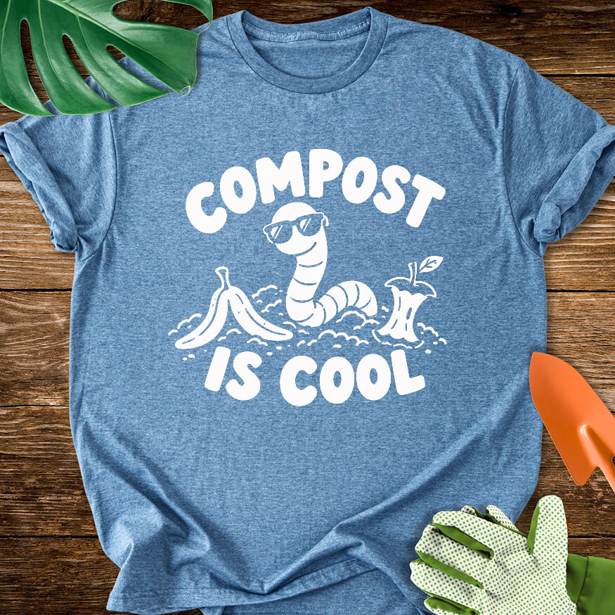 Heather indigo blue T-shirt with a worm in sunglasses among scraps with "Compost Is Cool".