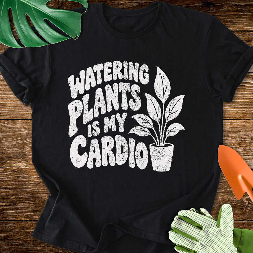 Black T-shirt with a potted plant beside bold "Watering Plants Is My Cardio" lettering.