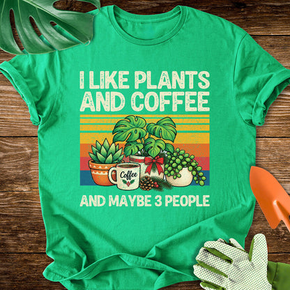 Irish green T-shirt with Christmas plants and coffee with "I Like Plants and Coffee and Maybe 3 People".