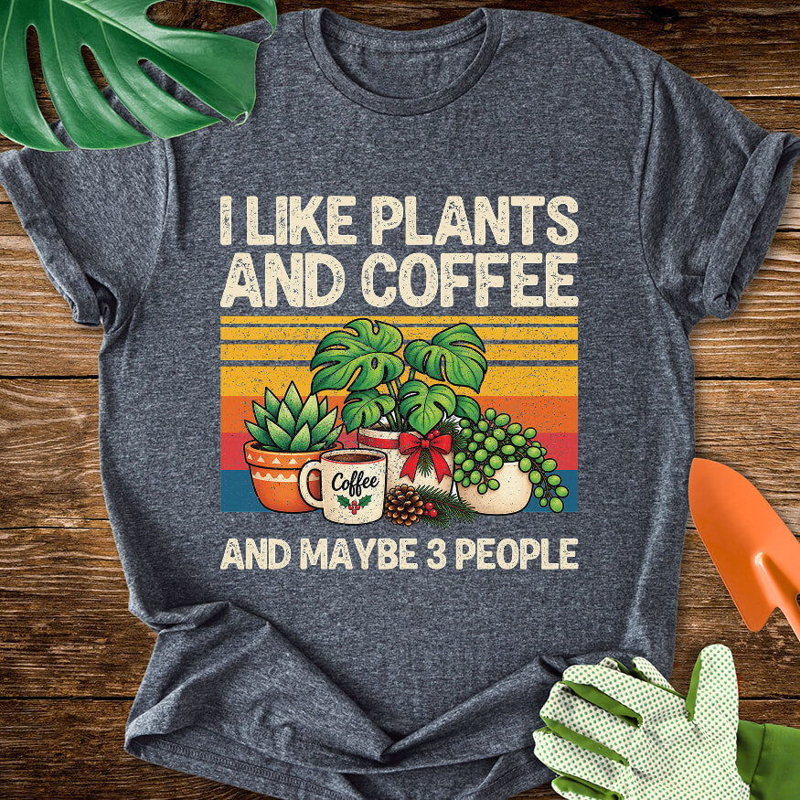 Dark heather gray T-shirt with Christmas plants and coffee with "I Like Plants and Coffee and Maybe 3 People".