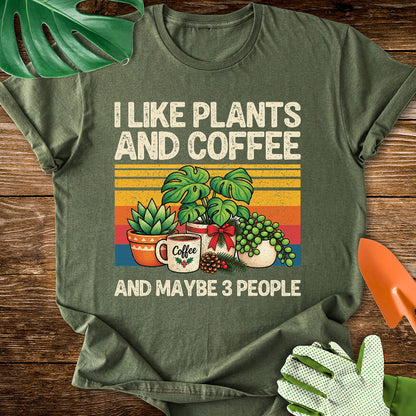 Military green T-shirt with Christmas plants and coffee with "I Like Plants and Coffee and Maybe 3 People".