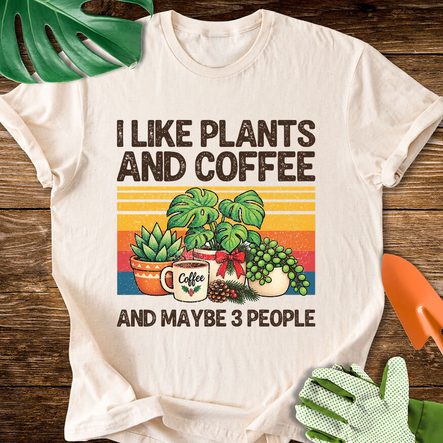 Natural cream T-shirt with Christmas plants and coffee with "I Like Plants and Coffee and Maybe 3 People".