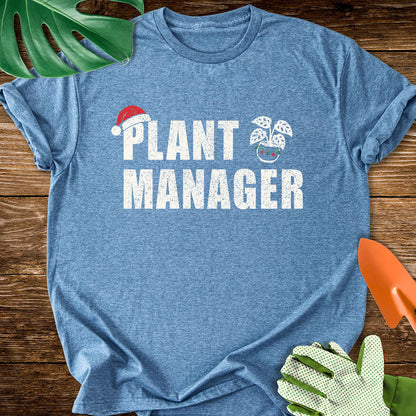Heather indigo blue T-shirt with a Santa hat, festive plant pot, and "Plant Manager" lettering.