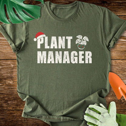 Military green T-shirt with a Santa hat, festive plant pot, and "Plant Manager" lettering.