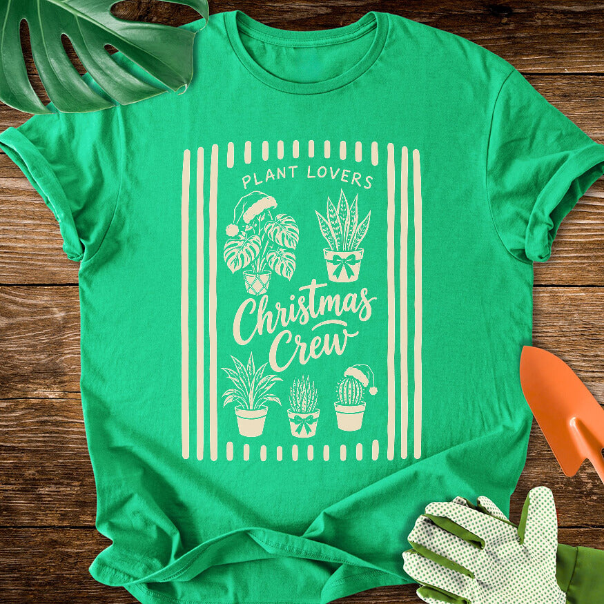 Irish green T-shirt with festive houseplants in a striped "Plant Lovers Christmas Crew" design.