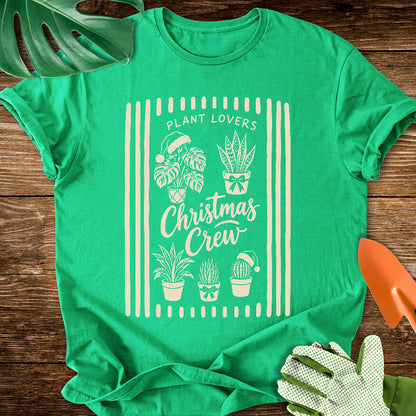 Irish green T-shirt with festive houseplants in a striped "Plant Lovers Christmas Crew" design.