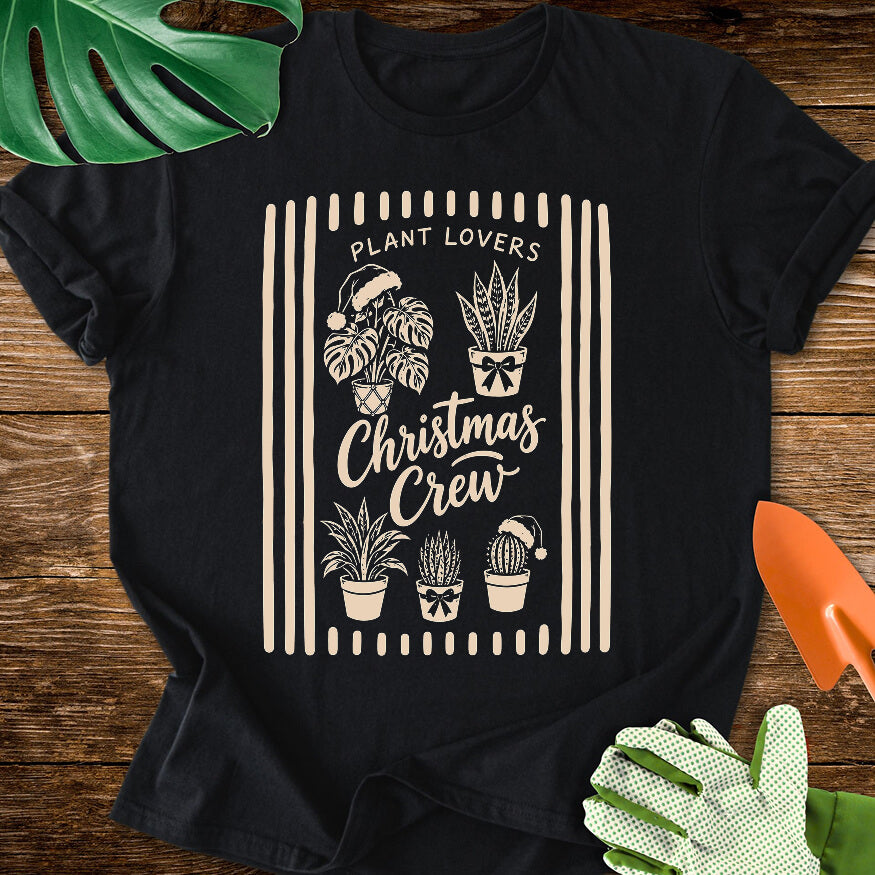 Black T-shirt with festive houseplants in a striped "Plant Lovers Christmas Crew" design.