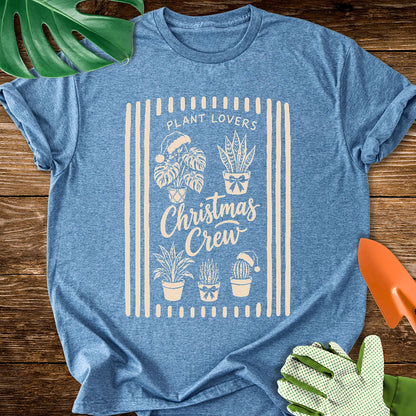 Heather indigo blue T-shirt with festive houseplants in a striped "Plant Lovers Christmas Crew" design.