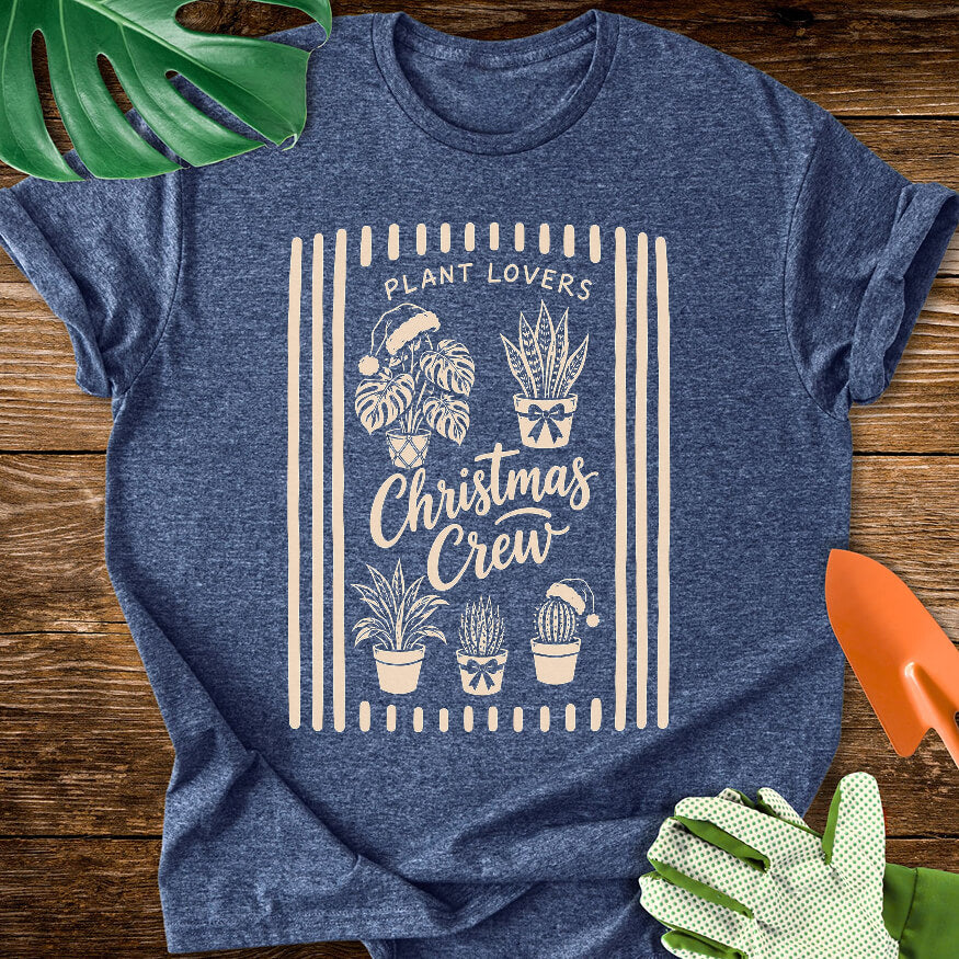Heather navy blue T-shirt with festive houseplants in a striped "Plant Lovers Christmas Crew" design.