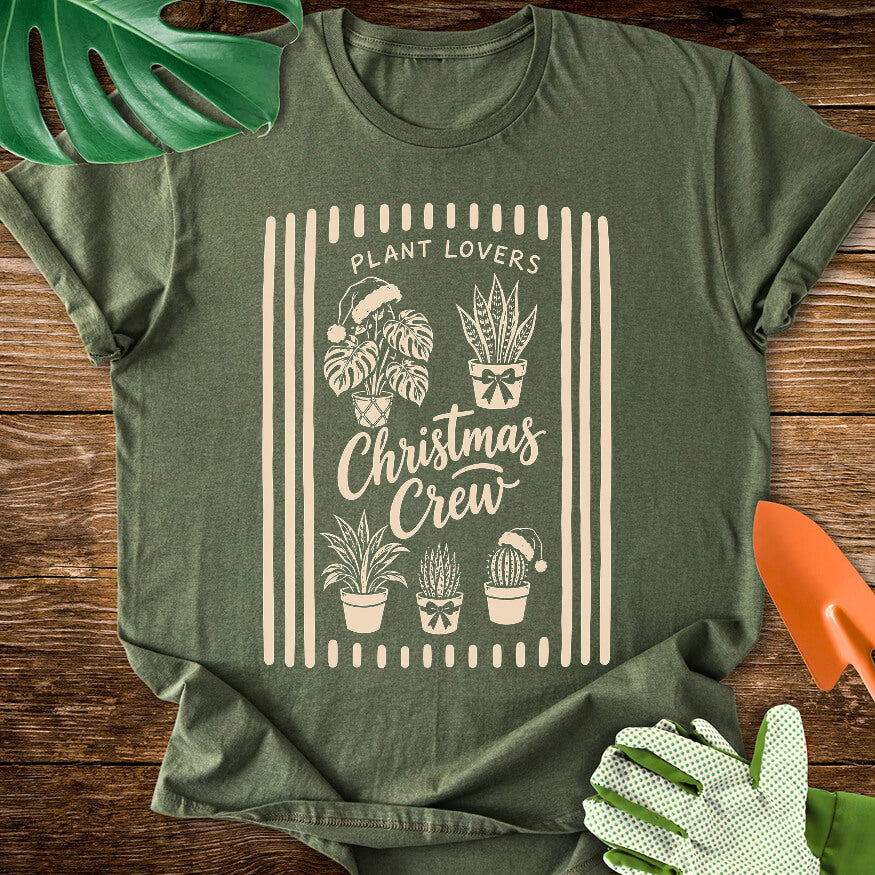 Military green T-shirt with festive houseplants in a striped "Plant Lovers Christmas Crew" design.