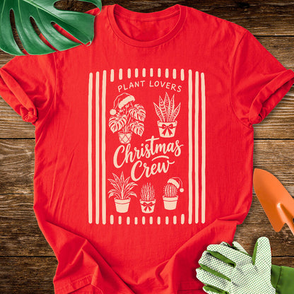 Red T-shirt with festive houseplants in a striped "Plant Lovers Christmas Crew" design.