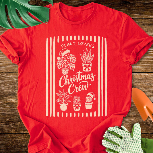 Red T-shirt with festive houseplants in a striped "Plant Lovers Christmas Crew" design.