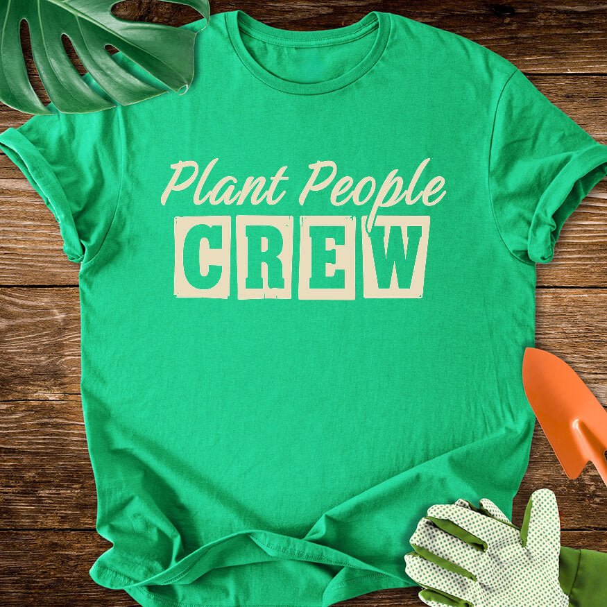 Irish green T-shirt with vintage-style lettering reading "Plant People Crew".