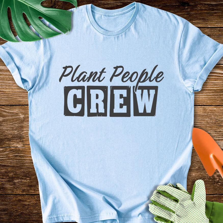 Light blue T-shirt with vintage-style lettering reading "Plant People Crew".