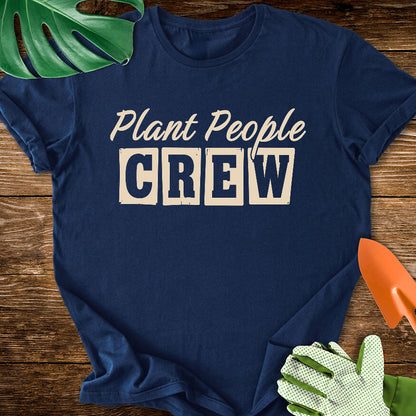 Navy blue T-shirt with vintage-style lettering reading "Plant People Crew".