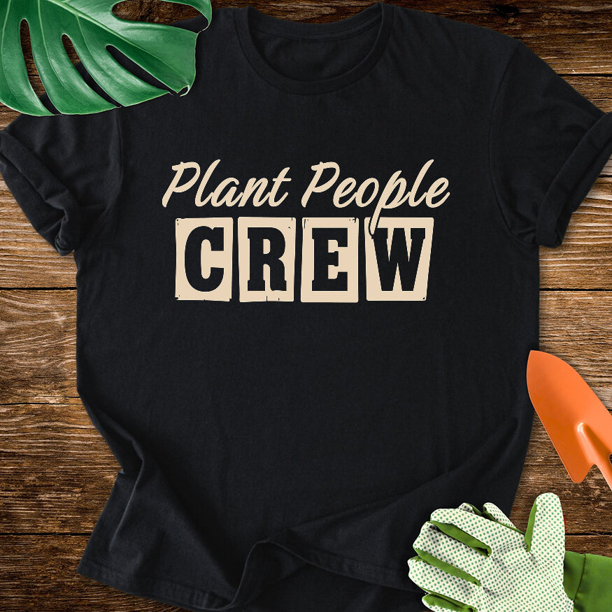 Black T-shirt with vintage-style lettering reading "Plant People Crew".