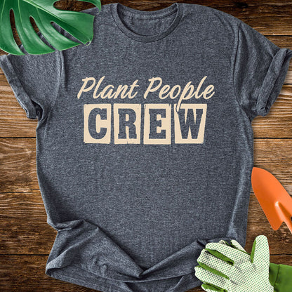 Dark heather gray T-shirt with vintage-style lettering reading "Plant People Crew".
