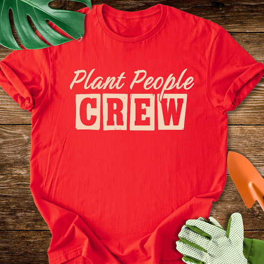 Red T-shirt with vintage-style lettering reading "Plant People Crew".