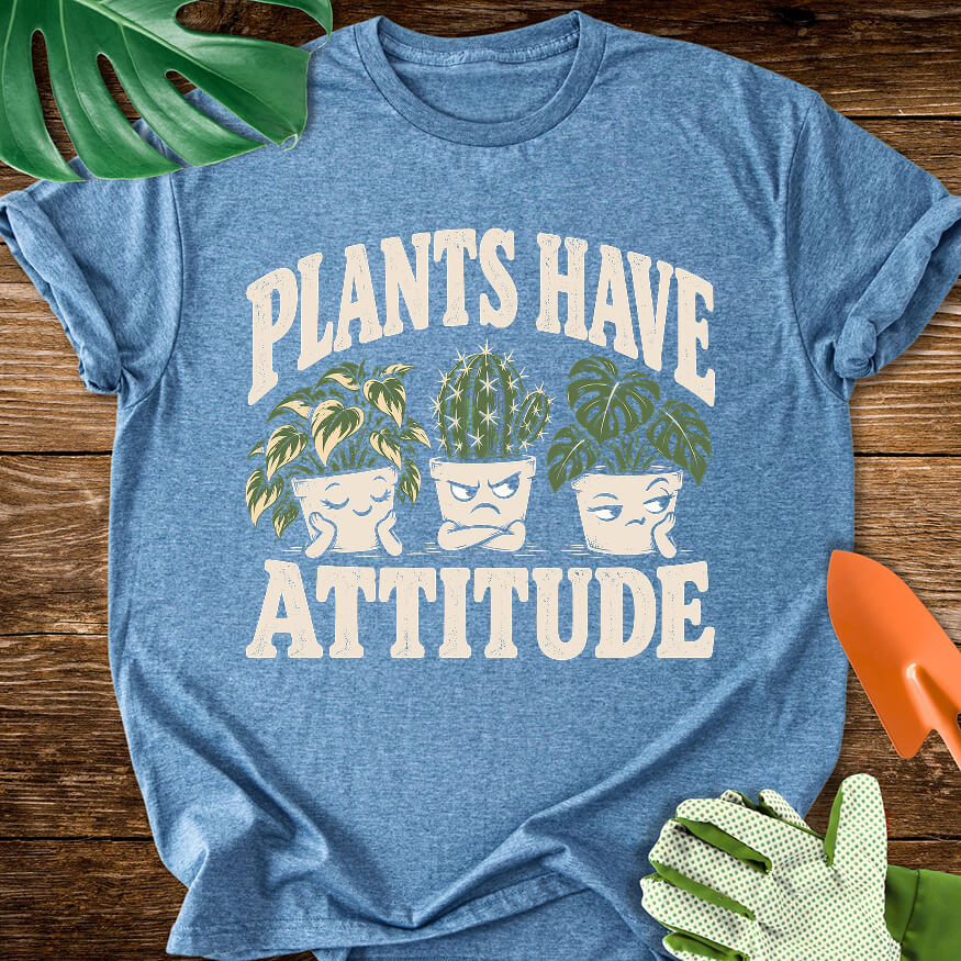 Heather indigo blue T-shirt with three expressive potted houseplants with "Plants Have Attitude".