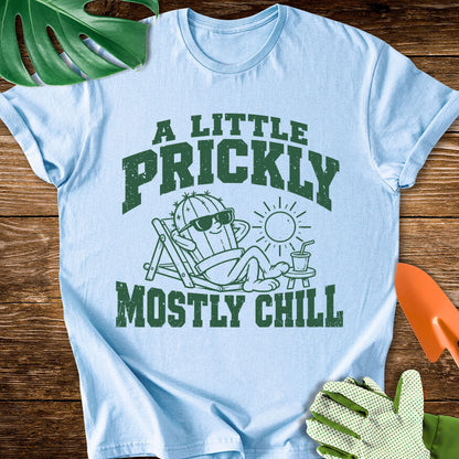 Light blue T-shirt with a cactus relaxing in sunglasses with "A Little Prickly, Mostly Chill".