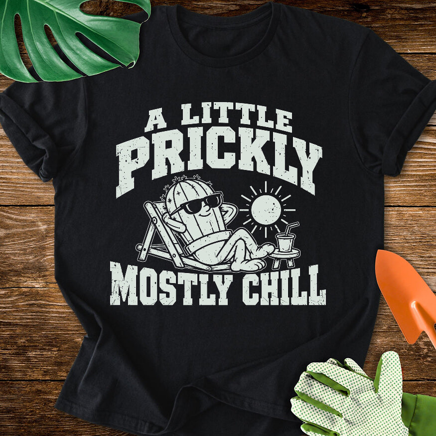 Black T-shirt with a cactus relaxing in sunglasses with "A Little Prickly, Mostly Chill".