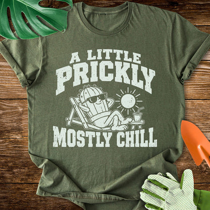 Military green T-shirt with a cactus relaxing in sunglasses with "A Little Prickly, Mostly Chill".