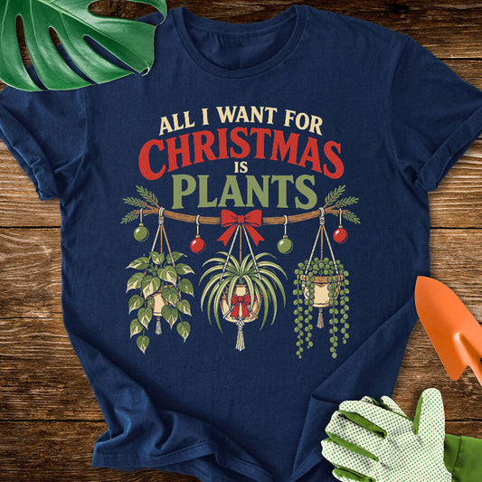 Navy blue T-shirt with festive hanging houseplants beneath "All I Want for Christmas Is Plants".