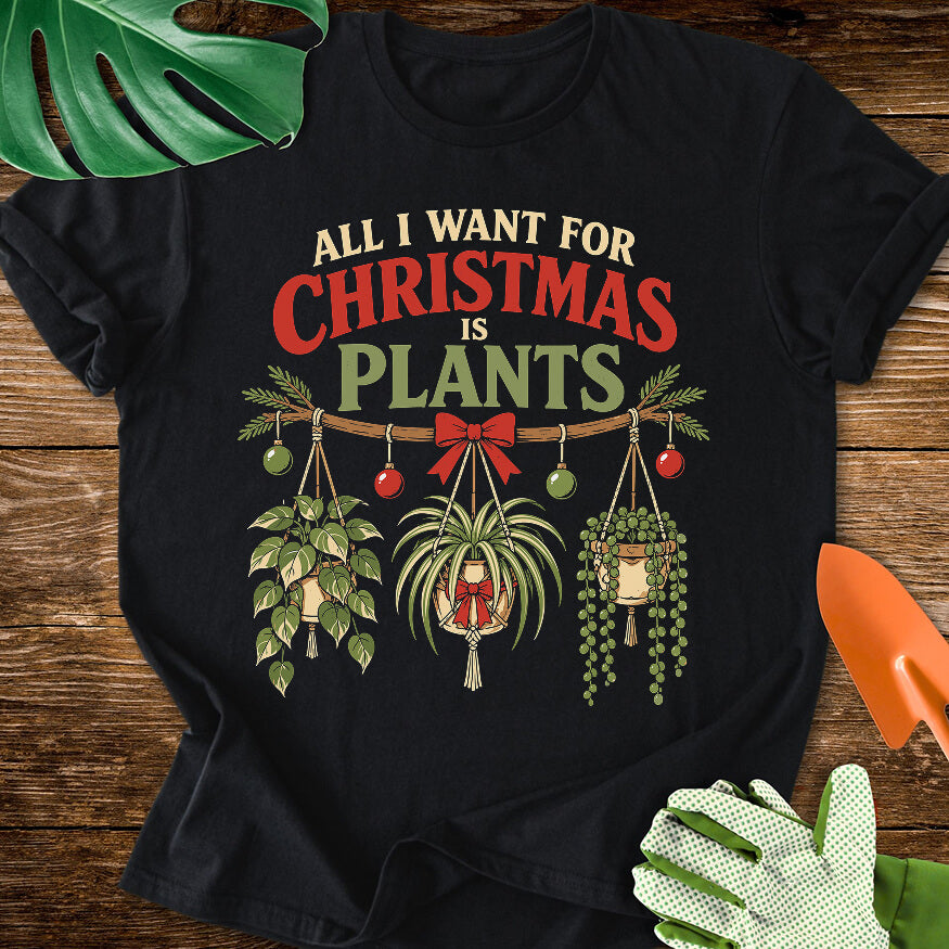 Black T-shirt with festive hanging houseplants beneath "All I Want for Christmas Is Plants".