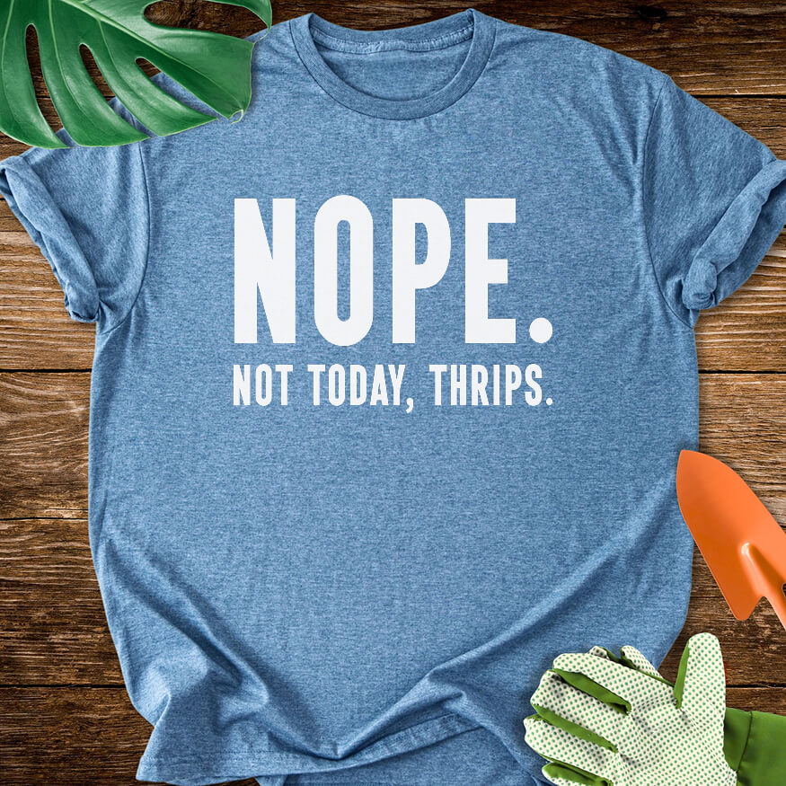Heather indigo blue T-shirt with bold lettering reading "Nope. Not Today, Thrips.".
