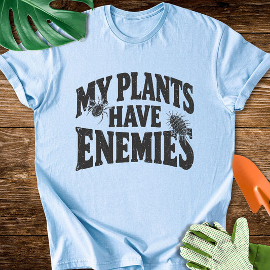 Light blue T-shirt with plant pest illustrations around "My Plants Have Enemies" lettering.