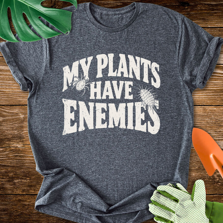 Dark heather gray T-shirt with plant pest illustrations around "My Plants Have Enemies" lettering.
