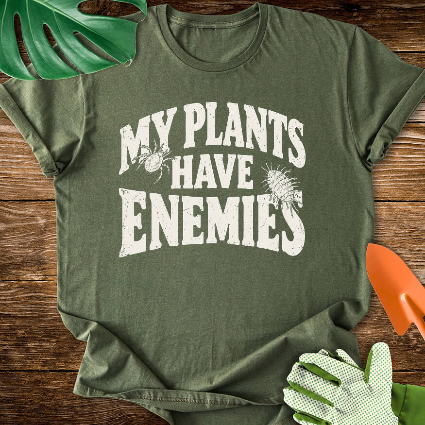 Military green T-shirt with plant pest illustrations around "My Plants Have Enemies" lettering.