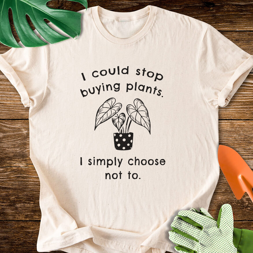 Natural cream T-shirt with a potted plant and "I Could Stop Buying Plants. I Simply Choose Not To.".