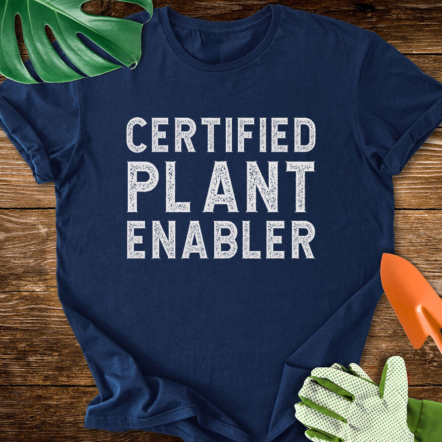 Navy blue T-shirt with bold distressed lettering reading "Certified Plant Enabler".