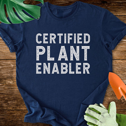 Navy blue T-shirt with bold distressed lettering reading "Certified Plant Enabler".